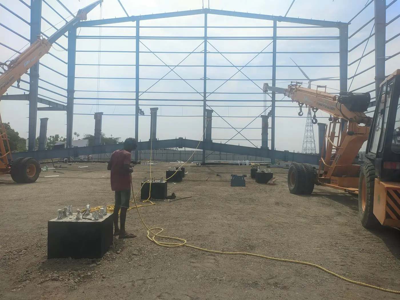 Anchor bolts set in the pedestals, ready for the columns being craned in behind