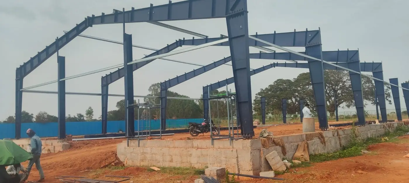 Portal frames erected on the plinth beam, bracing run between the bays