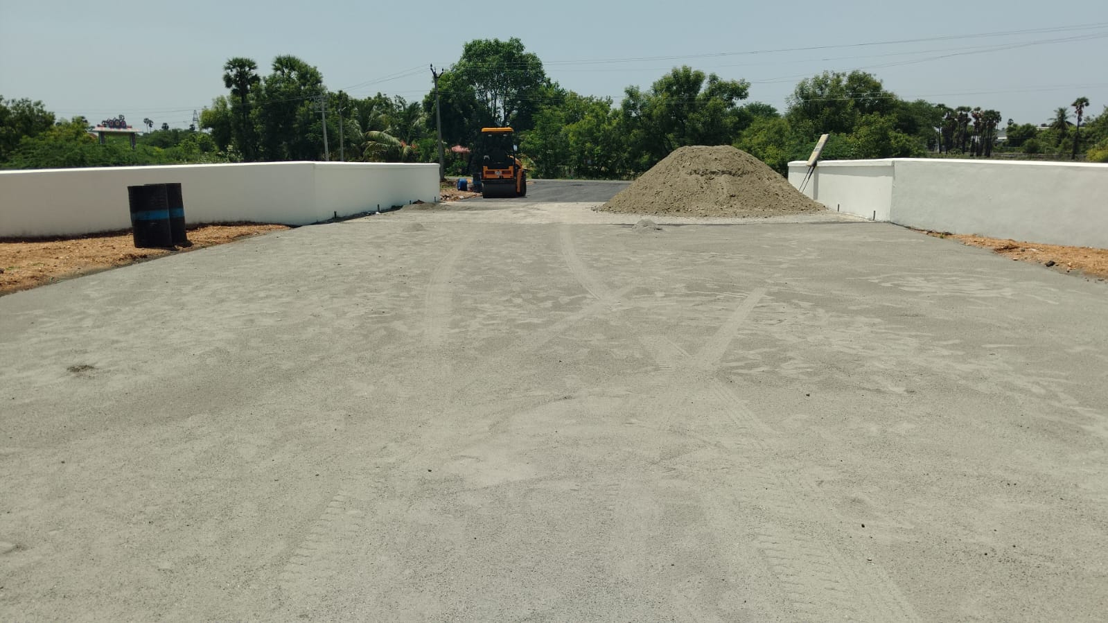 Compacted base course laid across the forecourt between the new compound walls