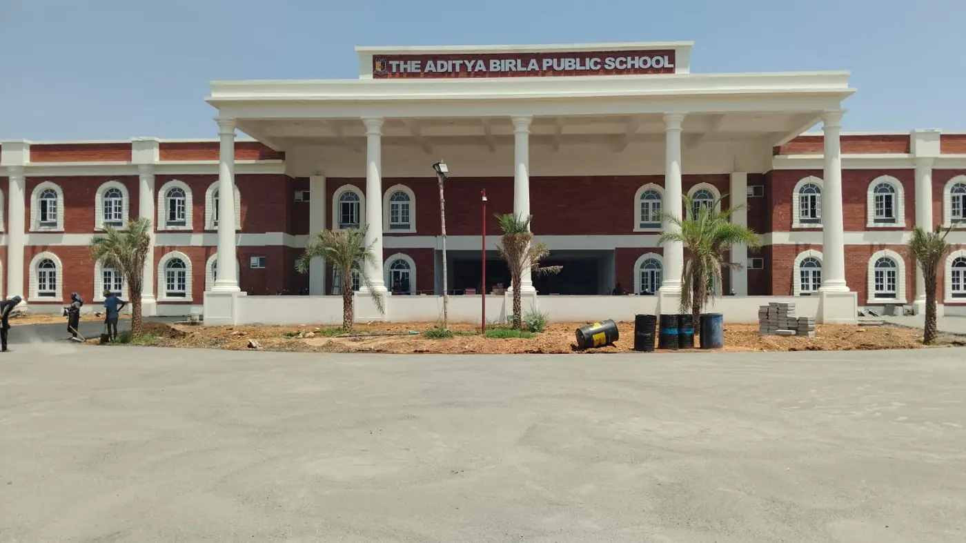 The Aditya Birla Public School - the finished two-storey brick and white block behind its new forecourt