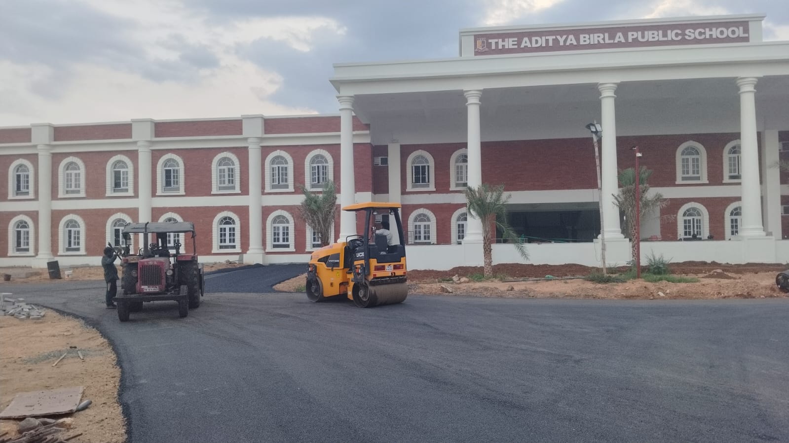 The school portico and colonnade, with the approach road being rolled in front of it