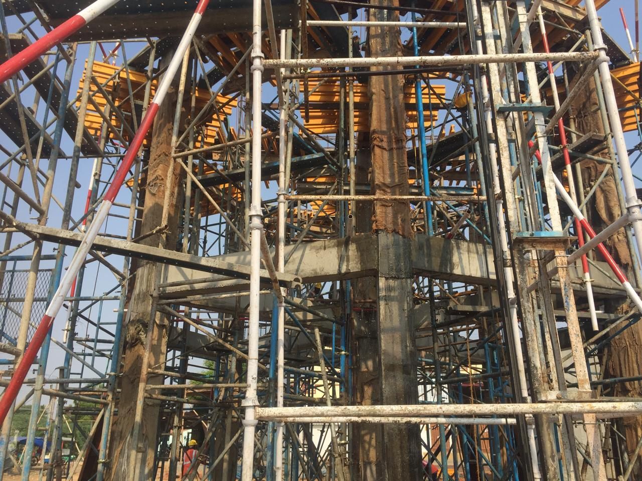 Scaffold and formwork close around the staging as the container floor is cast